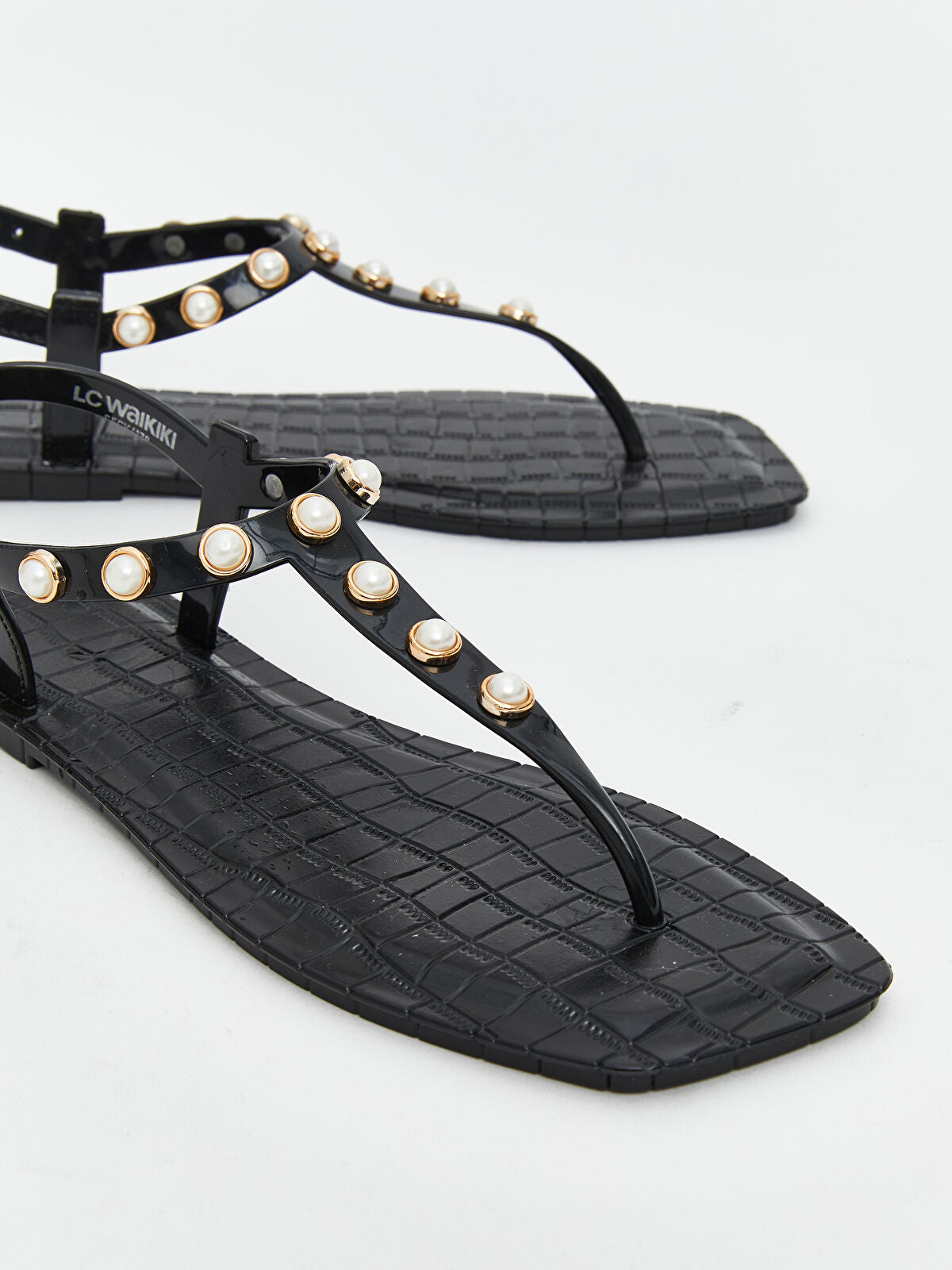 Woman's jeweled between-finger slippers